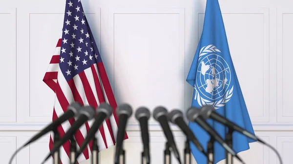 Banderas de los Estados Unidos y de las Naciones Unidas en reuniones o conferencias internacionales. Representación Editorial 3D —  Fotos de Stock