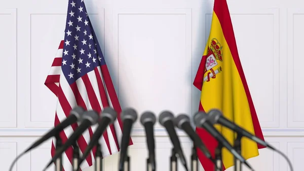 美国和西班牙的旗子在国际会议或会议上。3d 渲染 — 图库照片