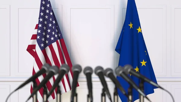 Drapeaux des États-Unis et de l'Union européenne lors d'une réunion ou conférence internationale. rendu 3D — Photo