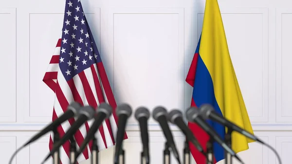 Σημαίες των ΗΠΑ και της Κολομβίας στο διεθνή σύσκεψη ή διάσκεψη. 3D rendering — Φωτογραφία Αρχείου