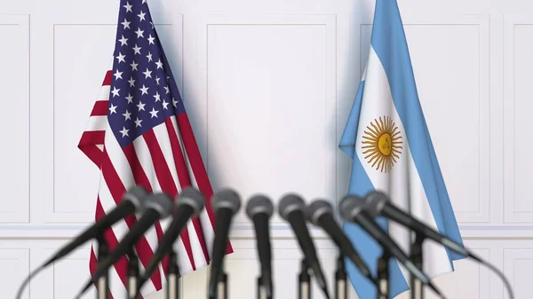 Banderas de Estados Unidos y Argentina en reunión o conferencia internacional. Renderizado 3D — Foto de Stock