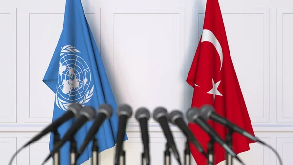 Flags of the United Nations and Turkey at international meeting or conference. Editorial 3D rendering — Stock Photo, Image