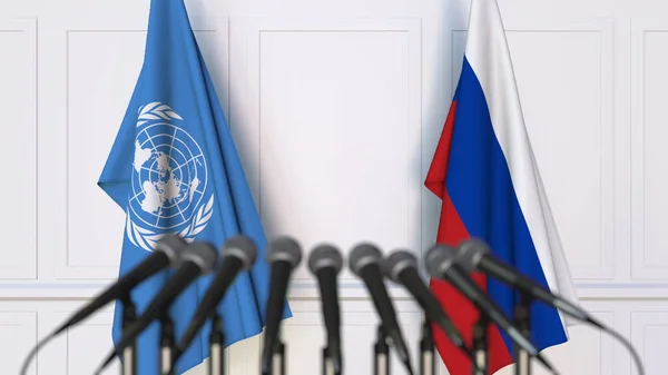 Σημαίες των Ηνωμένων Εθνών και της Ρωσίας στο διεθνή σύσκεψη ή διάσκεψη. Συντακτική 3d rendering — Φωτογραφία Αρχείου