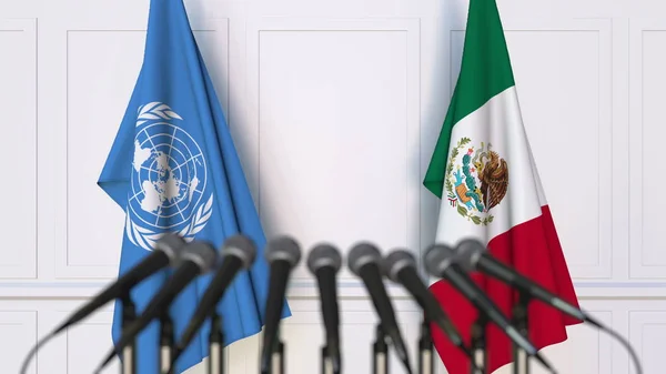 Flaggor i FN och Mexiko på internationellt möte eller konferens. Redaktionella 3d-rendering — Stockfoto