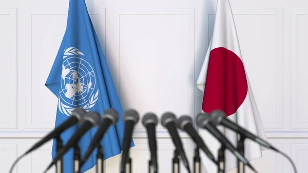 Drapeaux des Nations Unies et du Japon lors d'une réunion ou d'une conférence internationale. Editorial rendu 3D — Photo