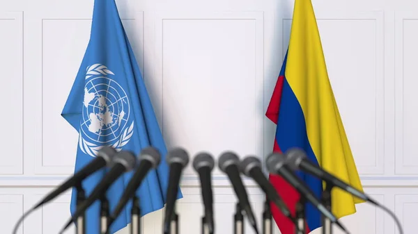 Σημαίες από τα Ηνωμένα Έθνη και την Κολομβία στο διεθνή σύσκεψη ή διάσκεψη. Συντακτική 3d rendering — Φωτογραφία Αρχείου