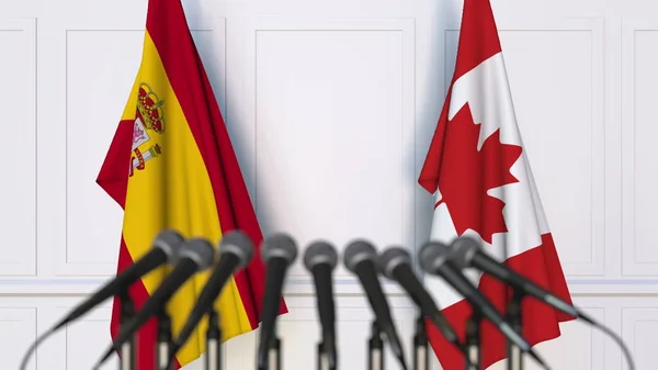 西班牙和加拿大在国际会议或会议上的旗帜。3d 渲染 — 图库照片