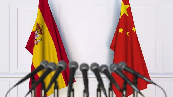 西班牙和中国在国际会议或会议上的旗帜。3d 渲染 — 图库照片