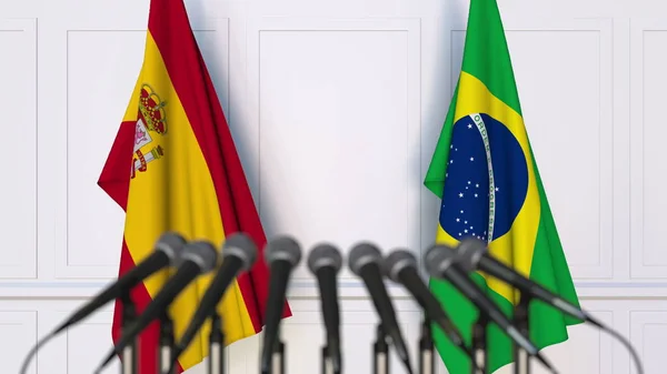 Bandeiras da Espanha e do Brasil em reunião ou conferência internacional. Renderização 3D — Fotografia de Stock