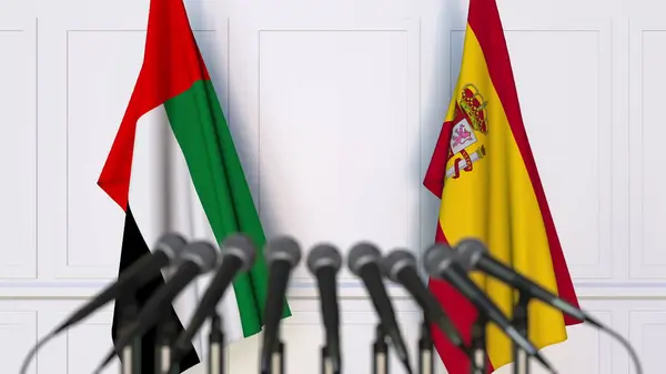 阿联酋和西班牙在国际会议或会议上的旗帜。3d 渲染 — 图库照片