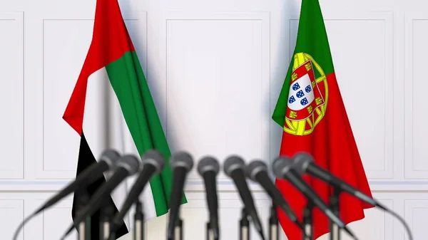 Flags of the UAE and Portugal at international meeting or conference. 3D rendering — Stock Photo, Image