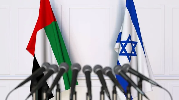 Drapeaux des Émirats arabes unis et d'Israël lors d'une réunion ou conférence internationale. rendu 3D — Photo