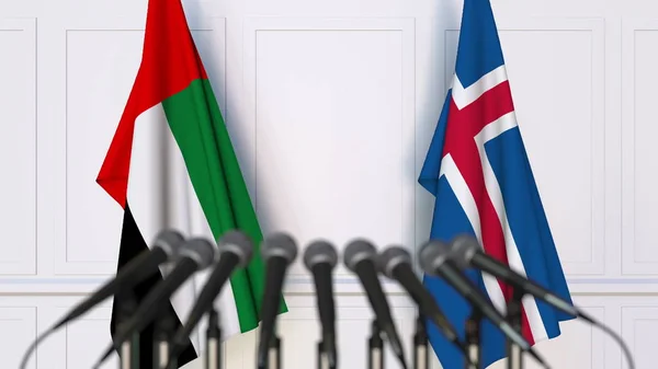 Флаги ОАЭ и Исландии на международной встрече или конференции. 3D рендеринг — стоковое фото