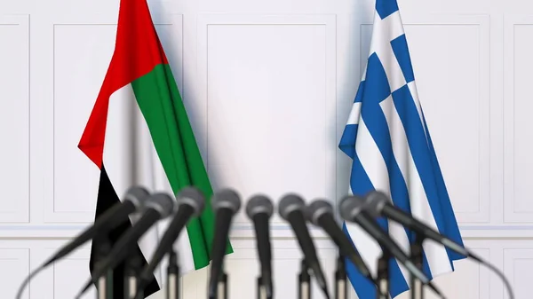 Flaggor i Förenade Arabemiraten och Grekland på internationellt möte eller konferens. 3D-rendering — Stockfoto