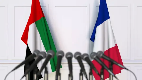 Flags of the UAE and France at international meeting or conference. 3D rendering — Stock Photo, Image