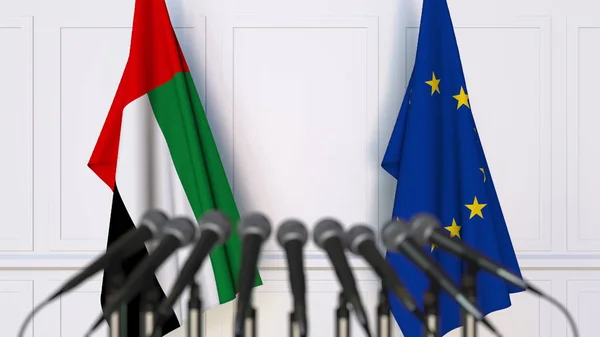 Drapeaux des Émirats arabes unis et de l'Union européenne lors d'une réunion ou d'une conférence internationale. rendu 3D — Photo