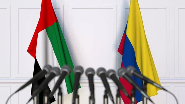 Flags of the UAE and Colombia at international meeting or conference. 3D rendering — Stock Photo, Image