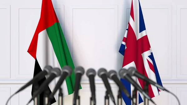 Flaggen der Vereinigten Staaten und des Vereinigten Königreichs bei internationalen Treffen oder Konferenzen. 3D-Darstellung — Stockfoto