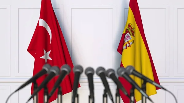 土耳其和西班牙在国际会议或会议上的旗帜。3d 渲染 — 图库照片