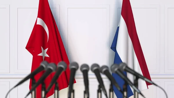Flags of Turkey and Netherlands at international meeting or conference. 3D rendering — Stock Photo, Image