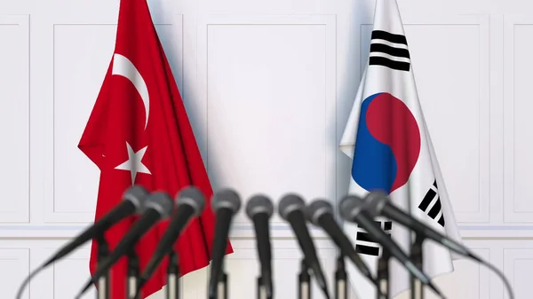 Bendera Turki dan Korea pada pertemuan atau konferensi internasional. Perender 3D — Stok Foto