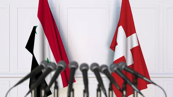 Bandeiras da Síria e Suíça em reunião ou conferência internacional. Renderização 3D — Fotografia de Stock