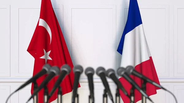 Flags of Turkey and France at international meeting or conference. 3D rendering — Stock Photo, Image