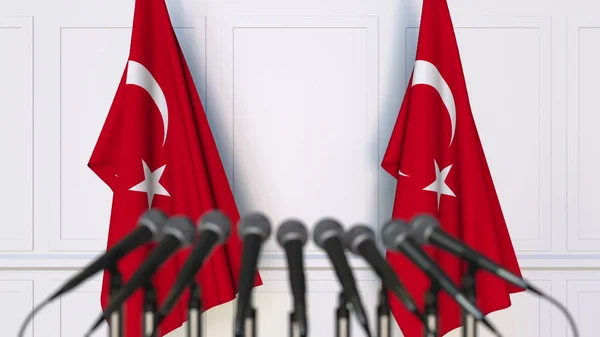 Turkish official press conference. Flags of Turkey and microphones. Conceptual 3D rendering — Stock Photo, Image