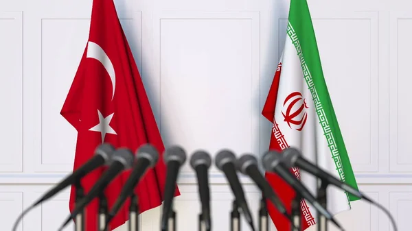 Flags of Turkey and Iran at international meeting or conference. 3D rendering — Stock Photo, Image