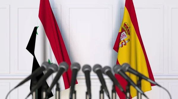 Bandiere della Siria e della Spagna in occasione di riunioni o conferenze internazionali. Rendering 3D — Foto Stock