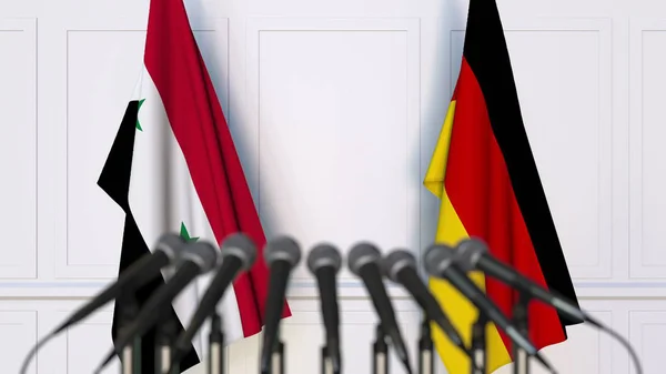 Σημαίες της Συρίας και της Γερμανίας στο διεθνή σύσκεψη ή διάσκεψη. 3D rendering — Φωτογραφία Αρχείου