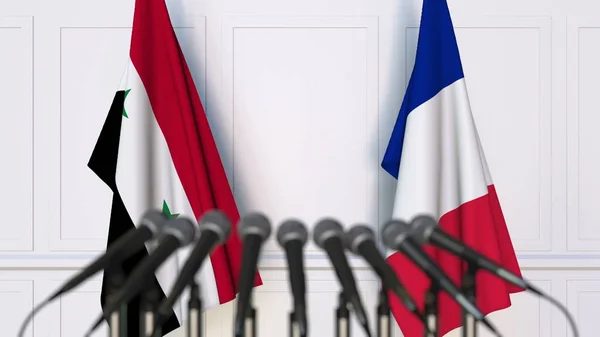 Флаги Сирии и Франции на международной встрече или конференции. 3D рендеринг — стоковое фото
