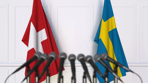 국제 회의 또는 회의에서 스위스와 스웨덴의 플래그입니다. 3 차원 렌더링 — 스톡 사진