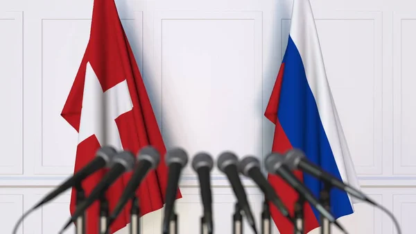 Σημαίες της Ελβετίας και της Ρωσίας στο διεθνή σύσκεψη ή διάσκεψη. 3D rendering — Φωτογραφία Αρχείου
