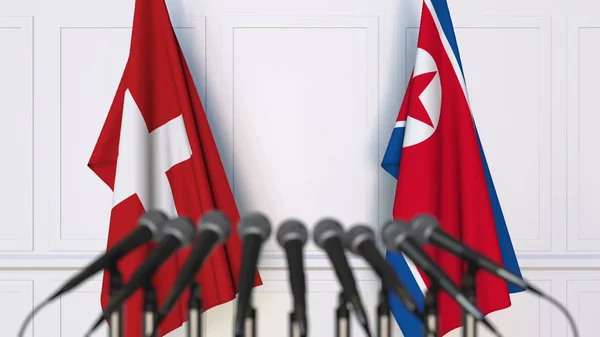 瑞士和北朝鲜在国际会议或会议上的旗帜。3d 渲染 — 图库照片