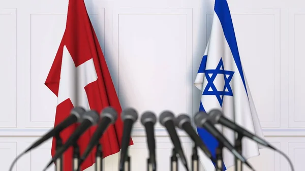 Drapeaux de la Suisse et d'Israël lors d'une réunion ou conférence internationale. rendu 3D — Photo