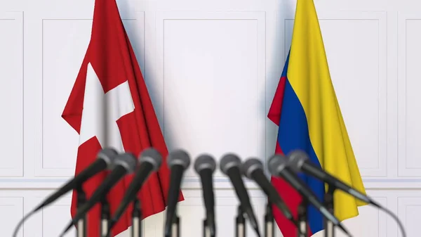 Σημαίες της Ελβετίας και της Κολομβίας στο διεθνή σύσκεψη ή διάσκεψη. 3D rendering — Φωτογραφία Αρχείου