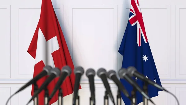 Flaggor i Schweiz och Australien på internationellt möte eller konferens. 3D-rendering — Stockfoto