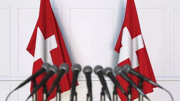 瑞士官方新闻发布会。瑞士国旗和麦克风。概念3d 渲染 — 图库照片
