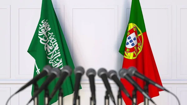 Σημαίες της Σαουδικής Αραβίας και της Πορτογαλίας στο διεθνή σύσκεψη ή διάσκεψη. 3D rendering — Φωτογραφία Αρχείου