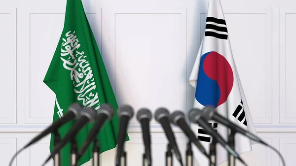 Flagi z Arabii Saudyjskiej i Korei na międzynarodowe spotkania lub konferencji. renderowania 3D — Zdjęcie stockowe