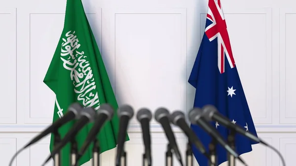 Flaggen Saudi Arabiens und Australiens bei internationalen Treffen oder Konferenzen. 3D-Darstellung — Stockfoto