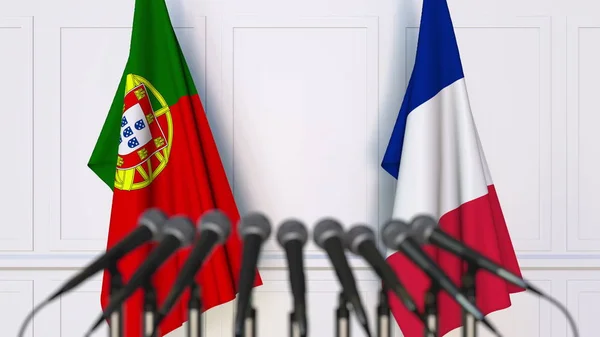 Σημαίες της Πορτογαλίας και της Γαλλίας στο διεθνή σύσκεψη ή διάσκεψη. 3D rendering — Φωτογραφία Αρχείου