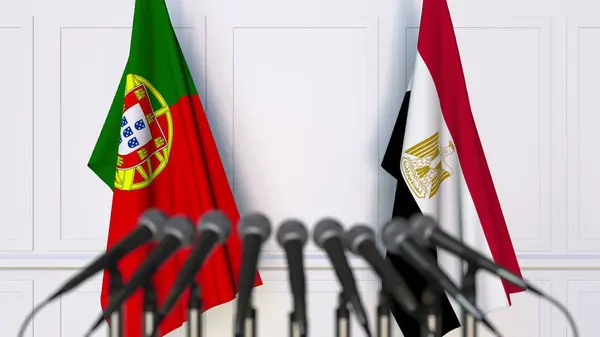 Σημαίες της Πορτογαλίας και της Αιγύπτου στο διεθνή σύσκεψη ή διάσκεψη. 3D rendering — Φωτογραφία Αρχείου