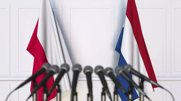 Σημαίες από την Πολωνία και τις κάτω χώρες στο διεθνή σύσκεψη ή διάσκεψη. 3D rendering — Φωτογραφία Αρχείου
