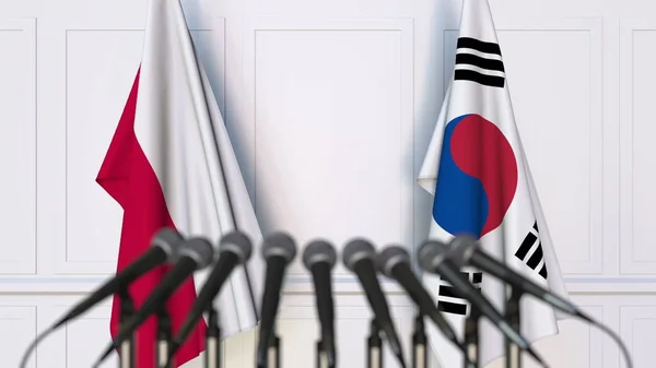 Bandeiras da Polônia e da Coreia em reunião ou conferência internacional. Renderização 3D — Fotografia de Stock