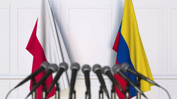 Banderas de Polonia y Colombia en reunión o conferencia internacional. Renderizado 3D — Foto de Stock