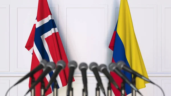 Bandiere della Norvegia e della Colombia in occasione di riunioni o conferenze internazionali. Rendering 3D — Foto Stock