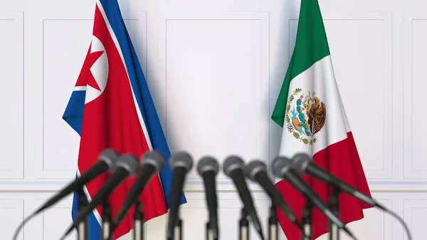 Banderas de Corea del Norte y México en reunión o conferencia internacional. Renderizado 3D —  Fotos de Stock