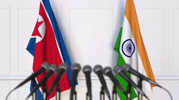 Flaggor i Nordkorea och Indien på internationellt möte eller konferens. 3D-rendering — Stockfoto